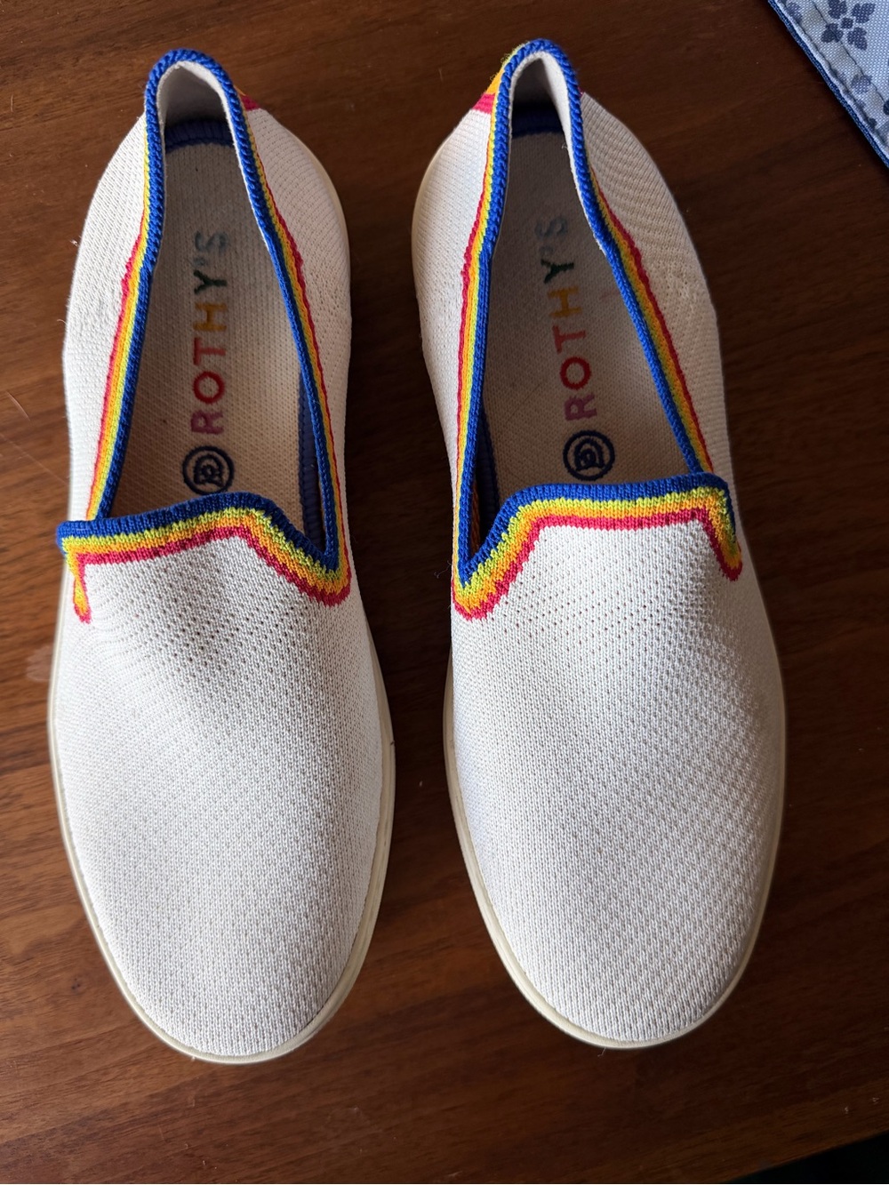 Rainbow Rothy's Cream Slip-On Sneakers with Rainbow Trim